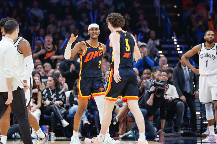 Dec 31, 2023; Oklahoma City, Oklahoma, USA; Oklahoma City Thunder guard Shai Gilgeous-Alexander (2) and Oklahoma City Thunder guard Josh Giddey (3) celebrate after a play against the Brooklyn Nets in the second half at Paycom Center.